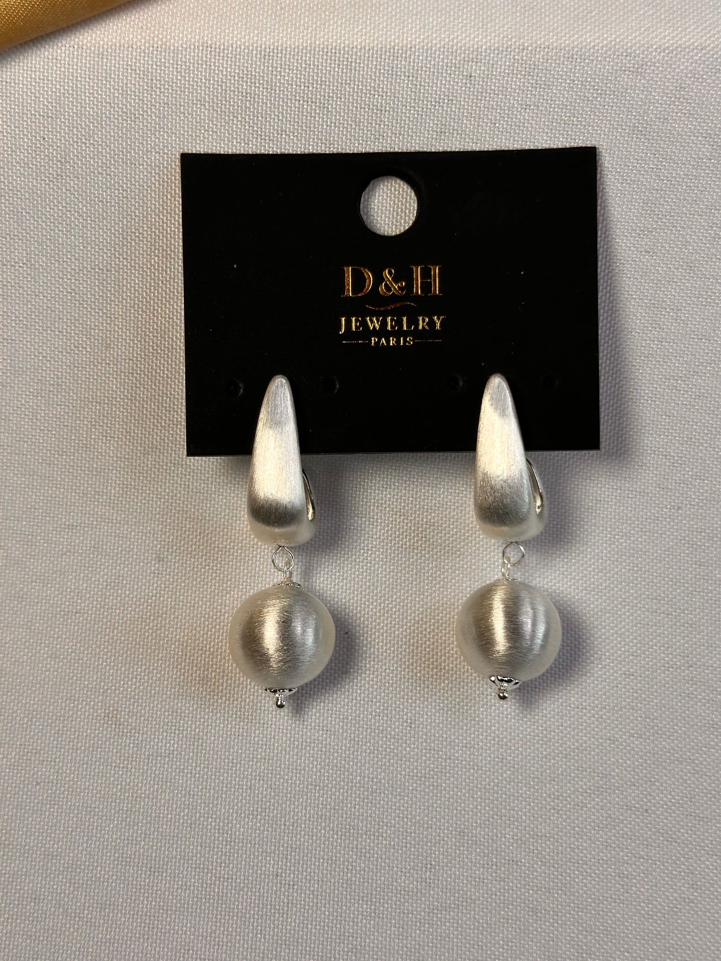 Boucles d’oreilles D&H Jewelry Paris – Design argenté sculptural